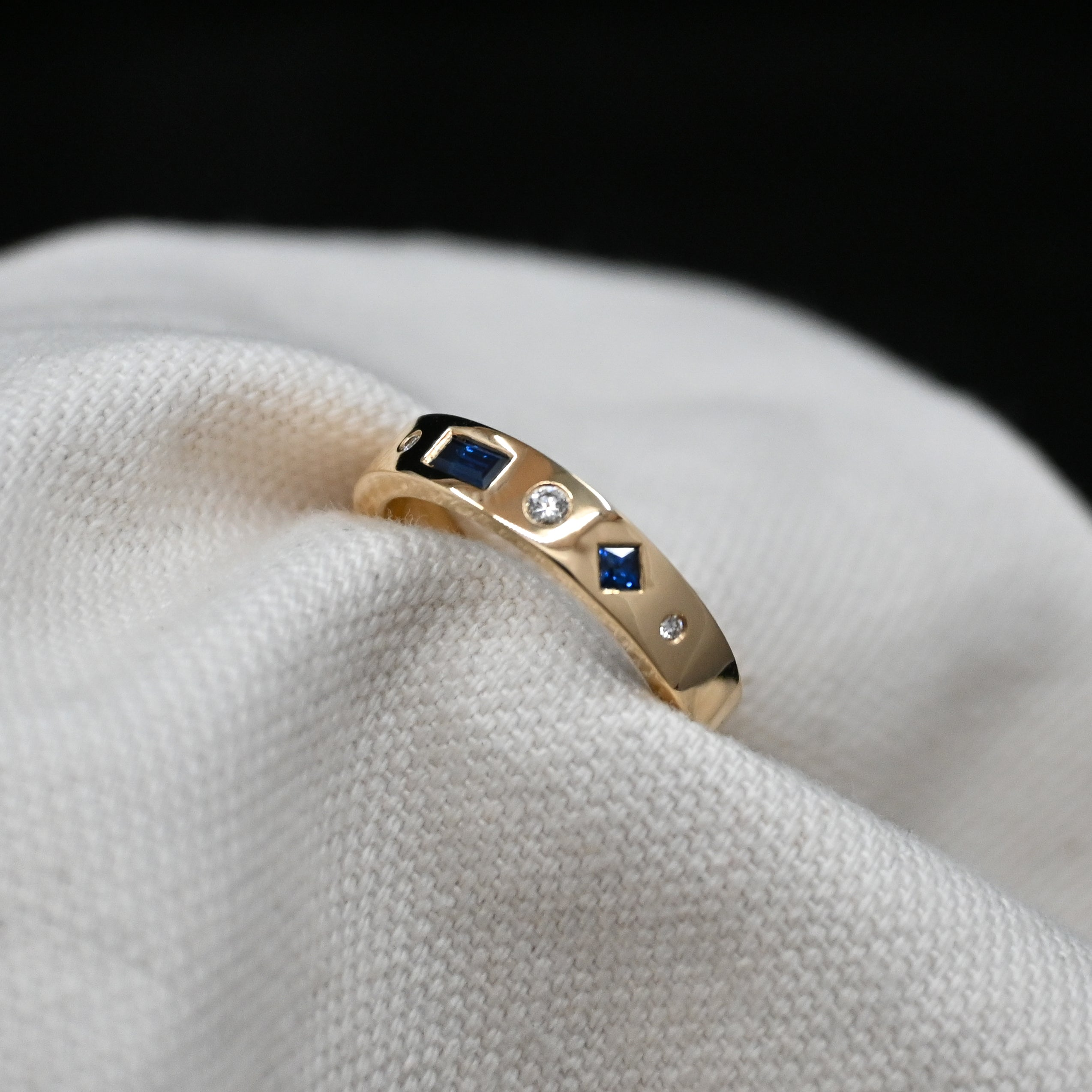 Sapphire and Diamond Solid Gold Band. Bespoke jewellery designer based in Tarporley, Cheshire, bespoke engagement rings, wedding bands and jewellery remodelling