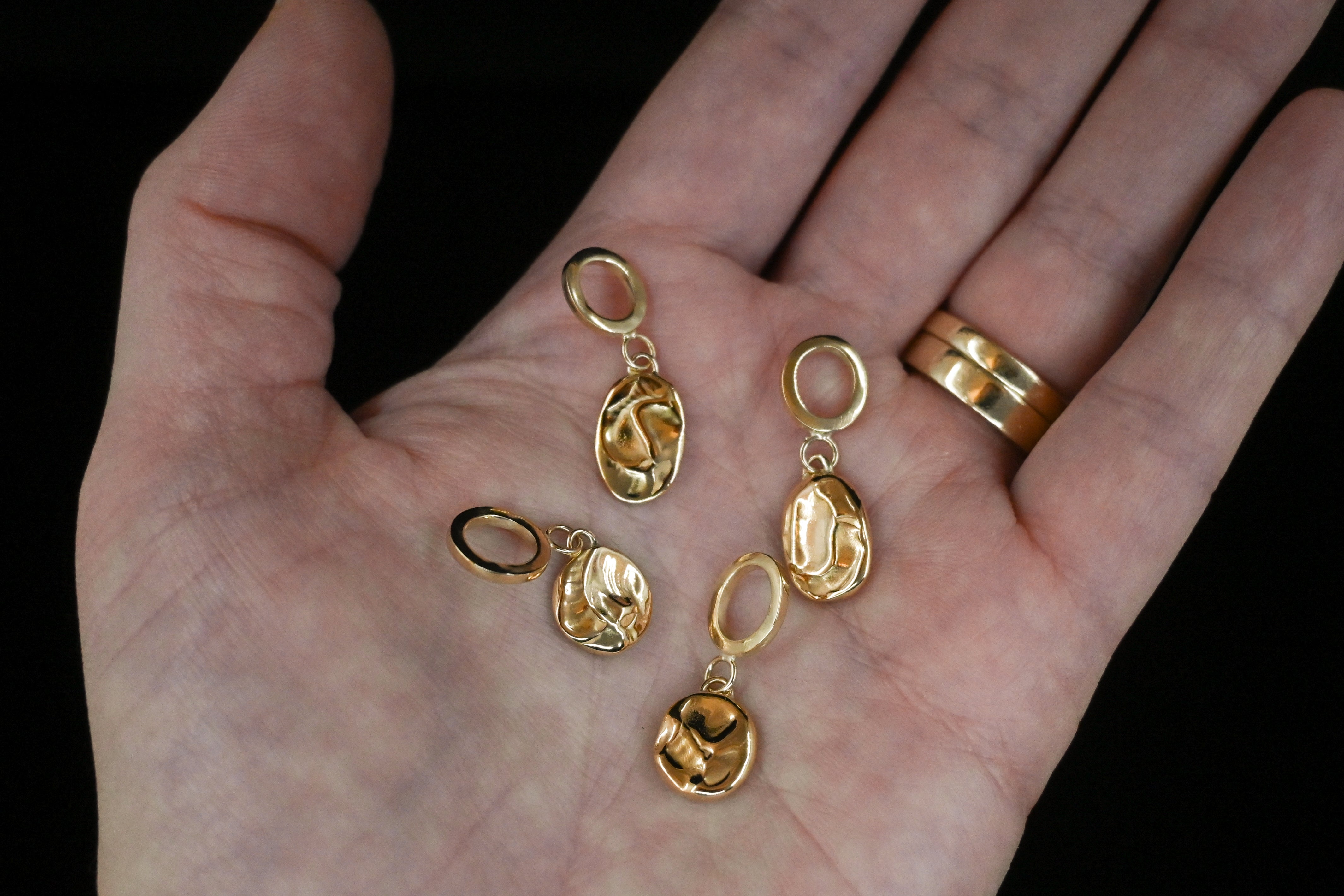 Textured solid gold charm pendants, bespoke jewellery design based in Tarporley Cheshire