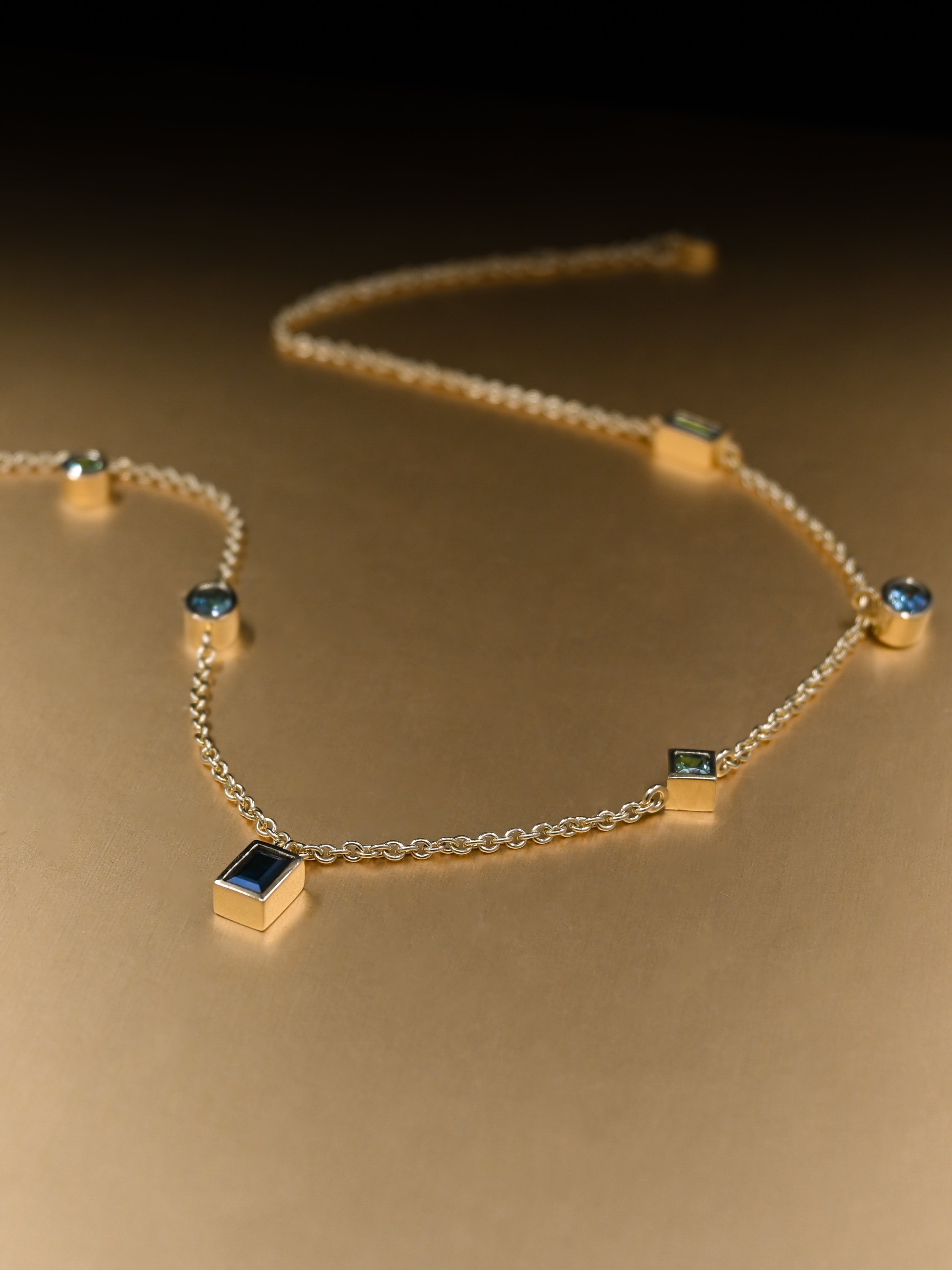 Mixed Cut Sapphire Pendants on an 18ct Fairmined Gold Chain Necklace