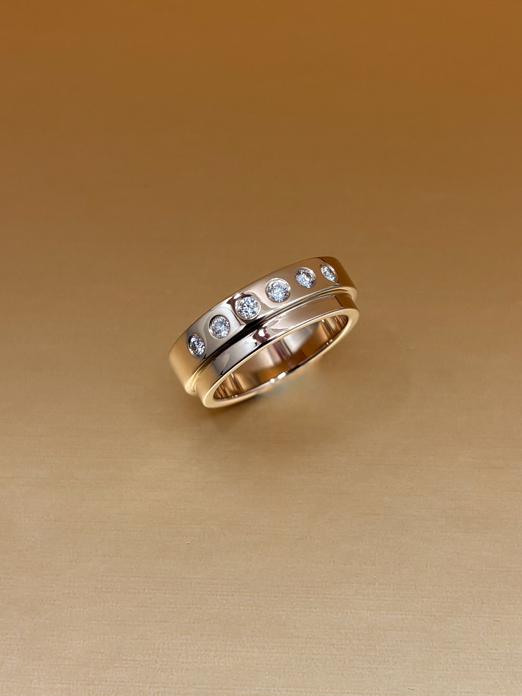 Diamond Solid Gold Stepped Band. Bespoke jewellery designer based in Tarporley, Cheshire, bespoke engagement rings, wedding bands and jewellery remodelling