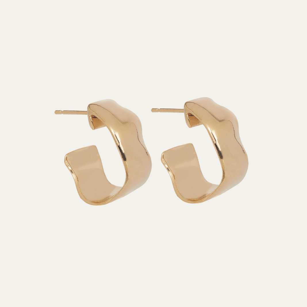 Gold hoop earrings on a white background