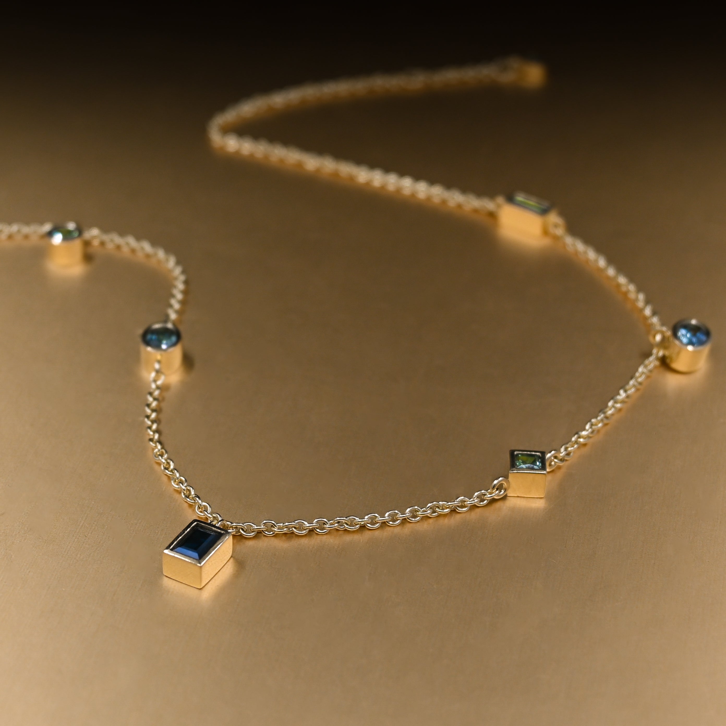 Mixed Cut Sapphire Pendants on an 18ct Fairmined Gold Chain Necklace