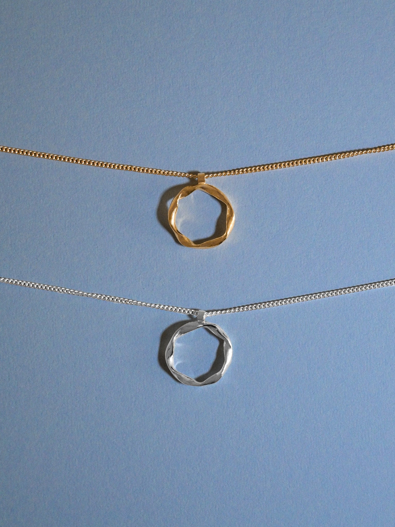 twisted pendant silver necklace and gold pendant neklace