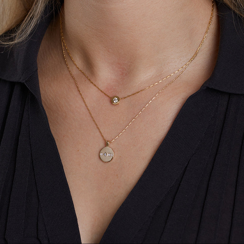 9ct solid yellow gold and 18ct solid yellow gold diamond pendant necklace worn on neck